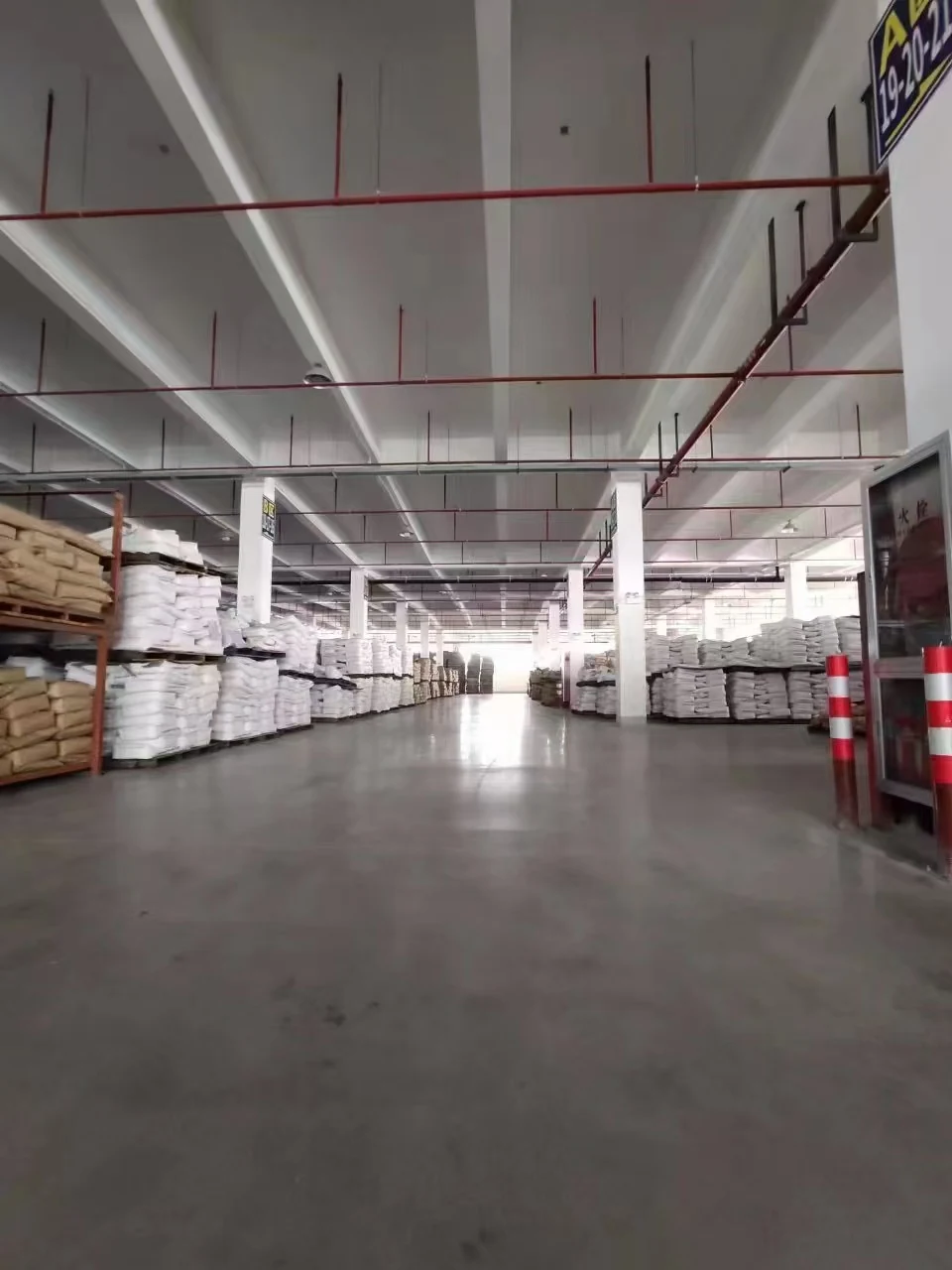 Stored cargo along a warehouse aisle, illustrating general cargo preparation.